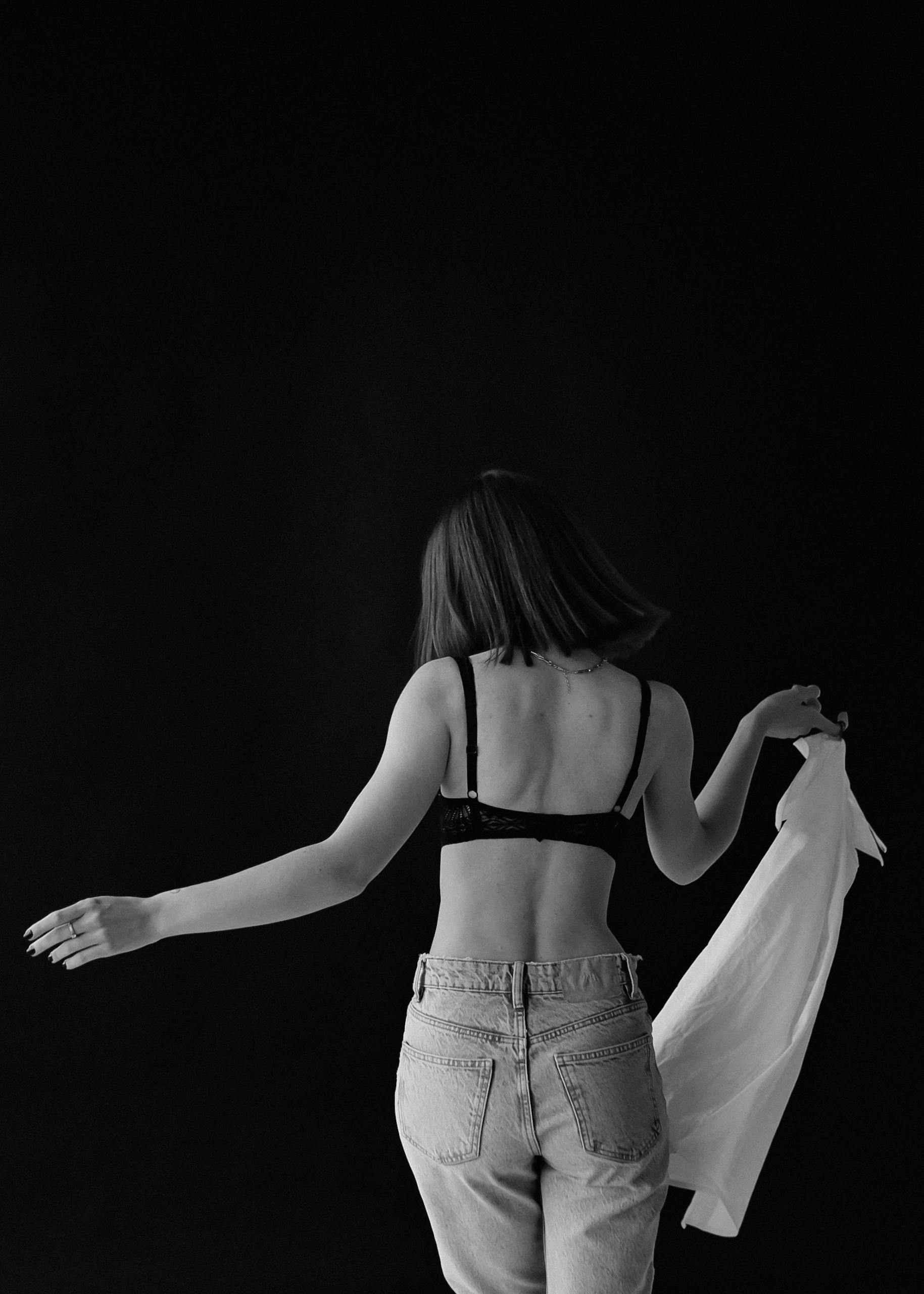 Back View of Woman in Bra in Black and White